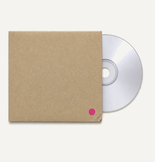 An unlabelled compact disc half out of a plain kraft paper sleeve, a small magenta dot stuck near one corner.